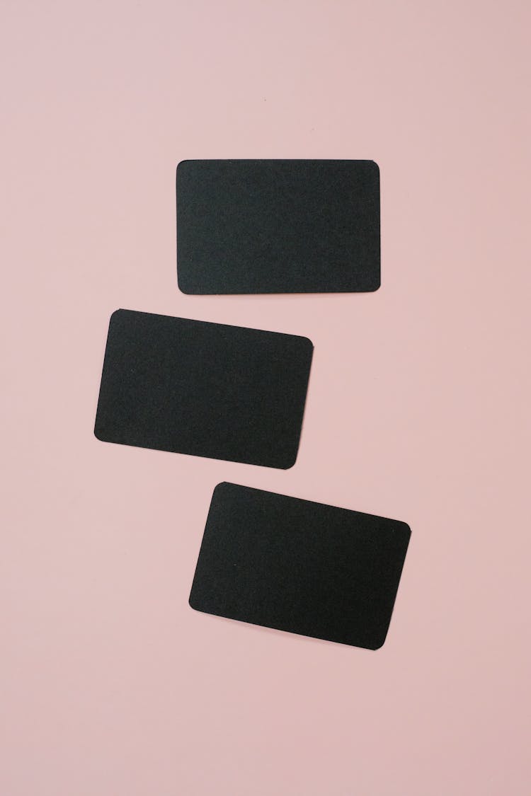 Black Rectangle Cards On A Pink Background