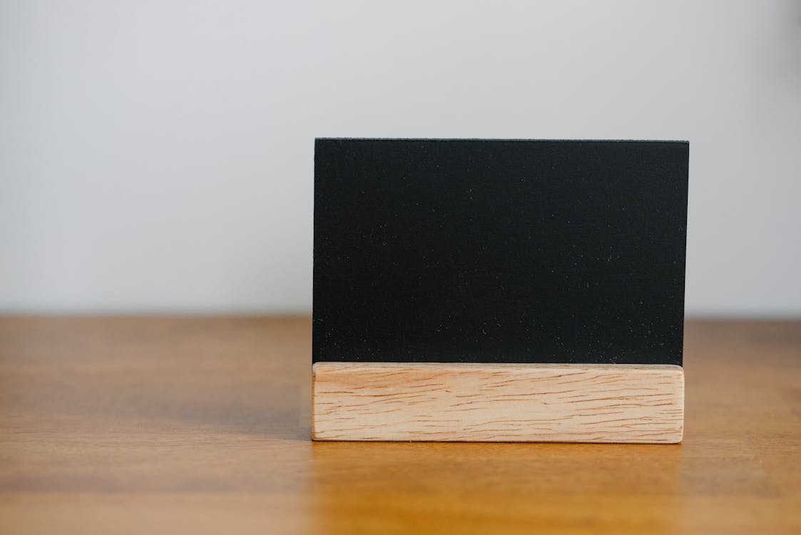 Free Name card on wooden table Stock Photo