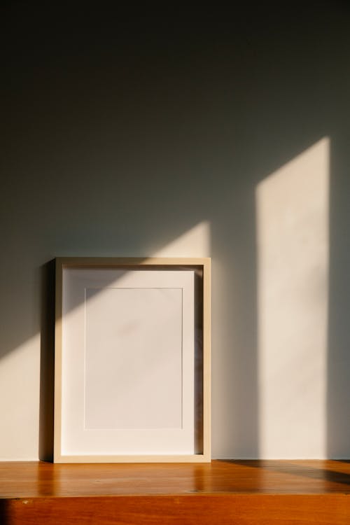 Free Empty frame on wooden shelf Stock Photo