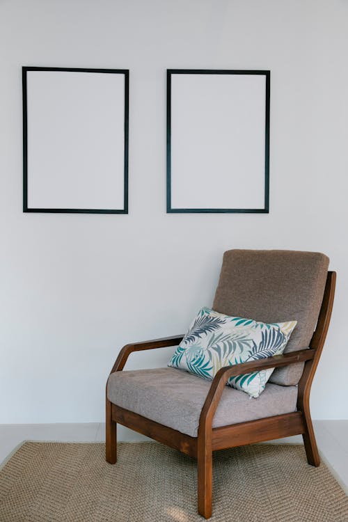 Cozy armchair with pillow in light room