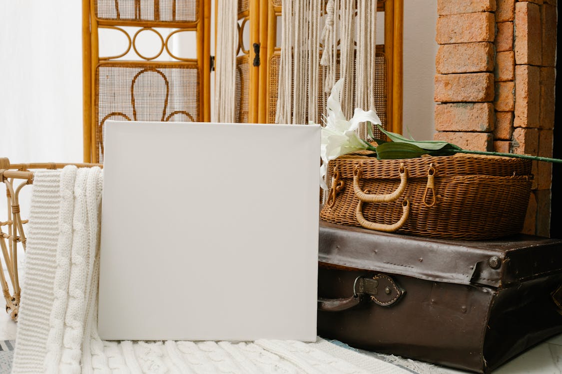 Free Canvas placed against retro suitcases and folding screen Stock Photo