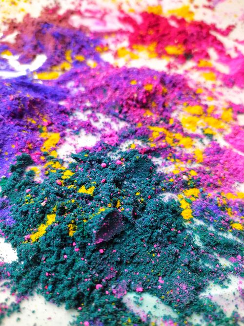 Free Close-up of vibrant colorful powders on a white surface, showcasing a striking mix of colors. Stock Photo
