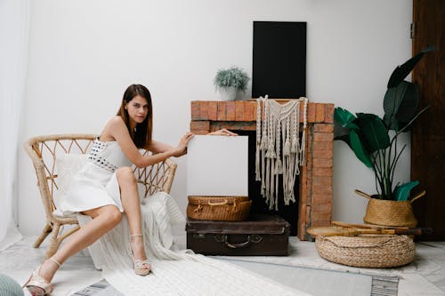 Free Trendy woman showing blank canvas in classic room Stock Photo