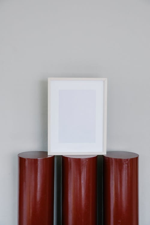 Free Blank frame placed on round stand Stock Photo