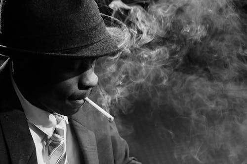 Close-Up Photo of Man Smoking Cigarette