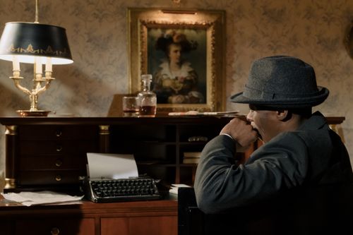 Free Cinematic portrayal of a detective in a vintage office, creating a mysterious and retro ambiance. Stock Photo