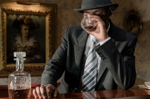 Photo of Investigator Drinking Whiskey