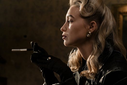 Glamorous vintage portrait of a woman with blonde curls smoking in noir style.