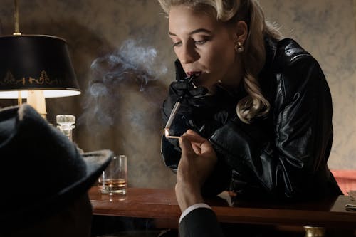 Free Photo of Man Lighting the Woman's Cigarette Stock Photo