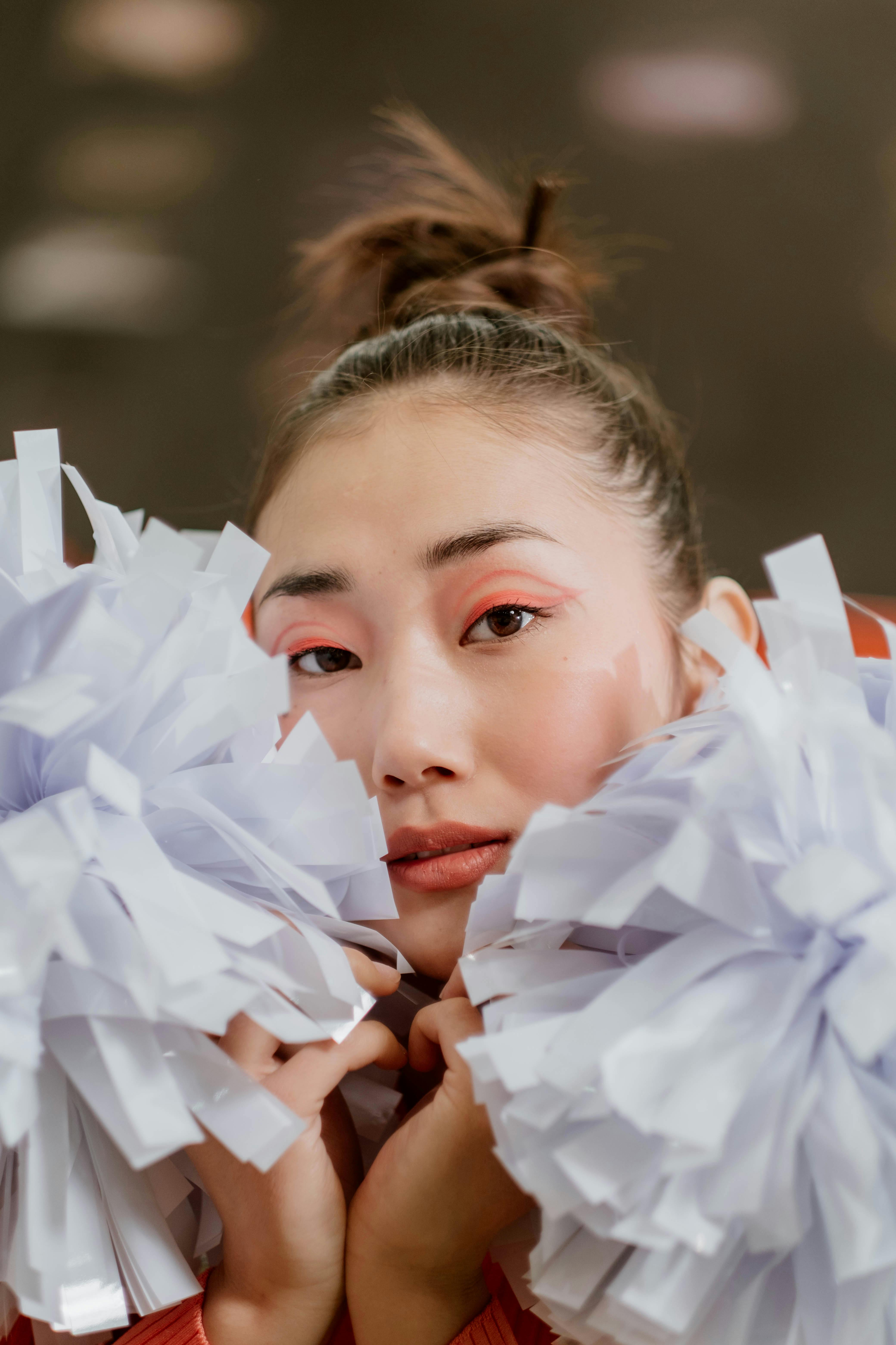 a cheerleader holding a pom pom