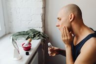 A Man Applying Cosmetic Product on Face