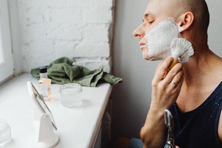 Man Applying Shaving Cream With A Brush 