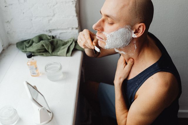 Lather worked along the jaw before a shave — photo by Kaboompics on Pexels
