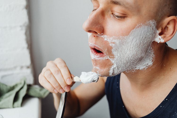 Man Shaving His Beard