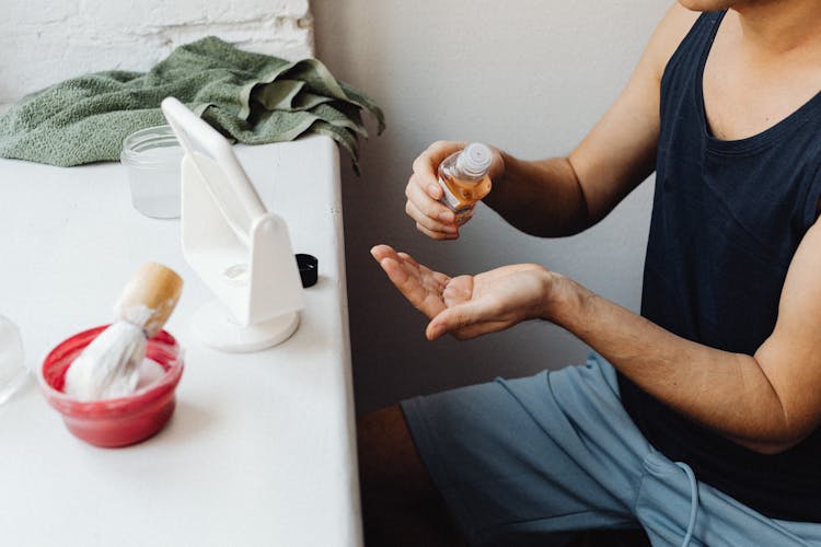 Man Using An After Shave 