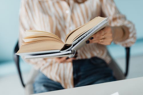Free Person Holding a Book  Stock Photo