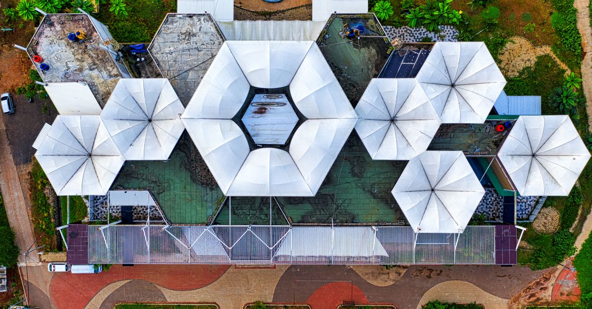 Aerial view of Christ Embassy Loveworld Arena in Ho, Volta Region, modern architecture with cross
