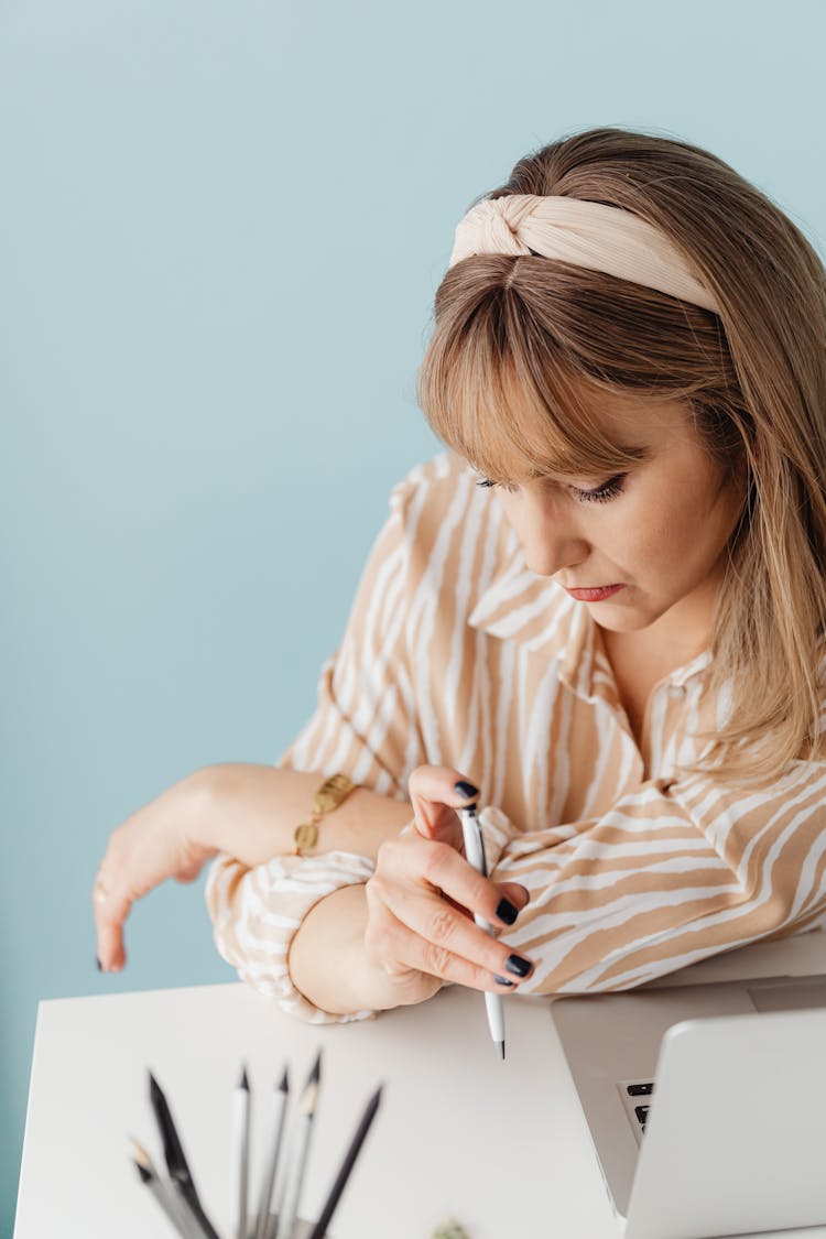 Woman Pushing The Button Of A Pen