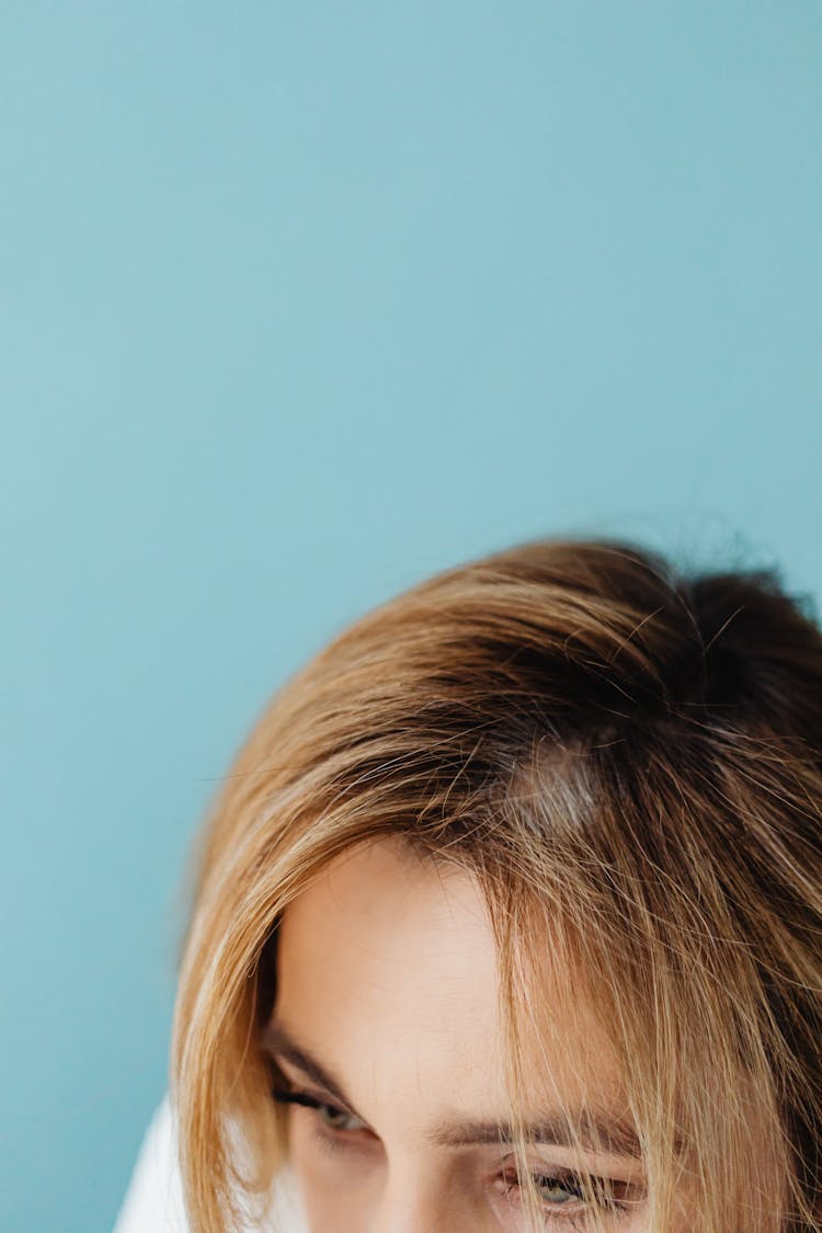 Hair Part And Forehead Of A Woman