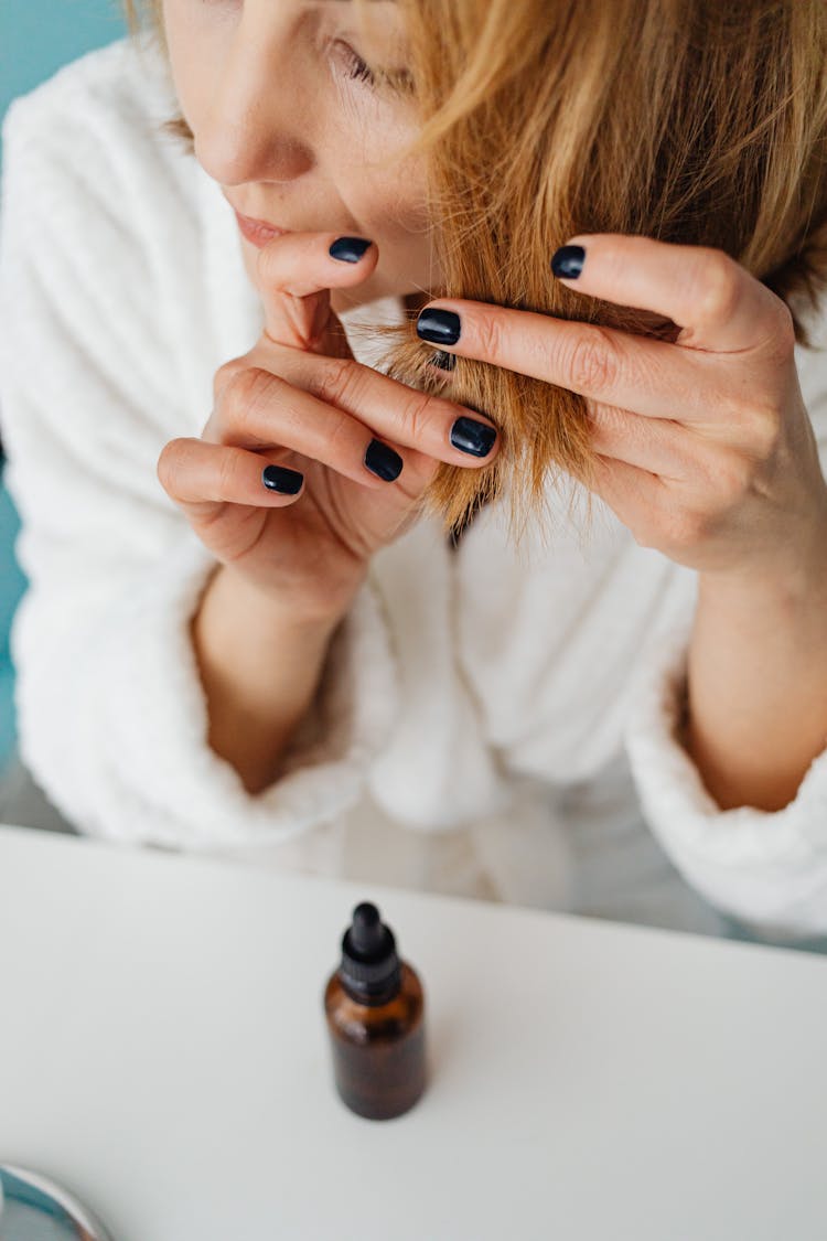 Close Up Of A Woman Touching Her Hair