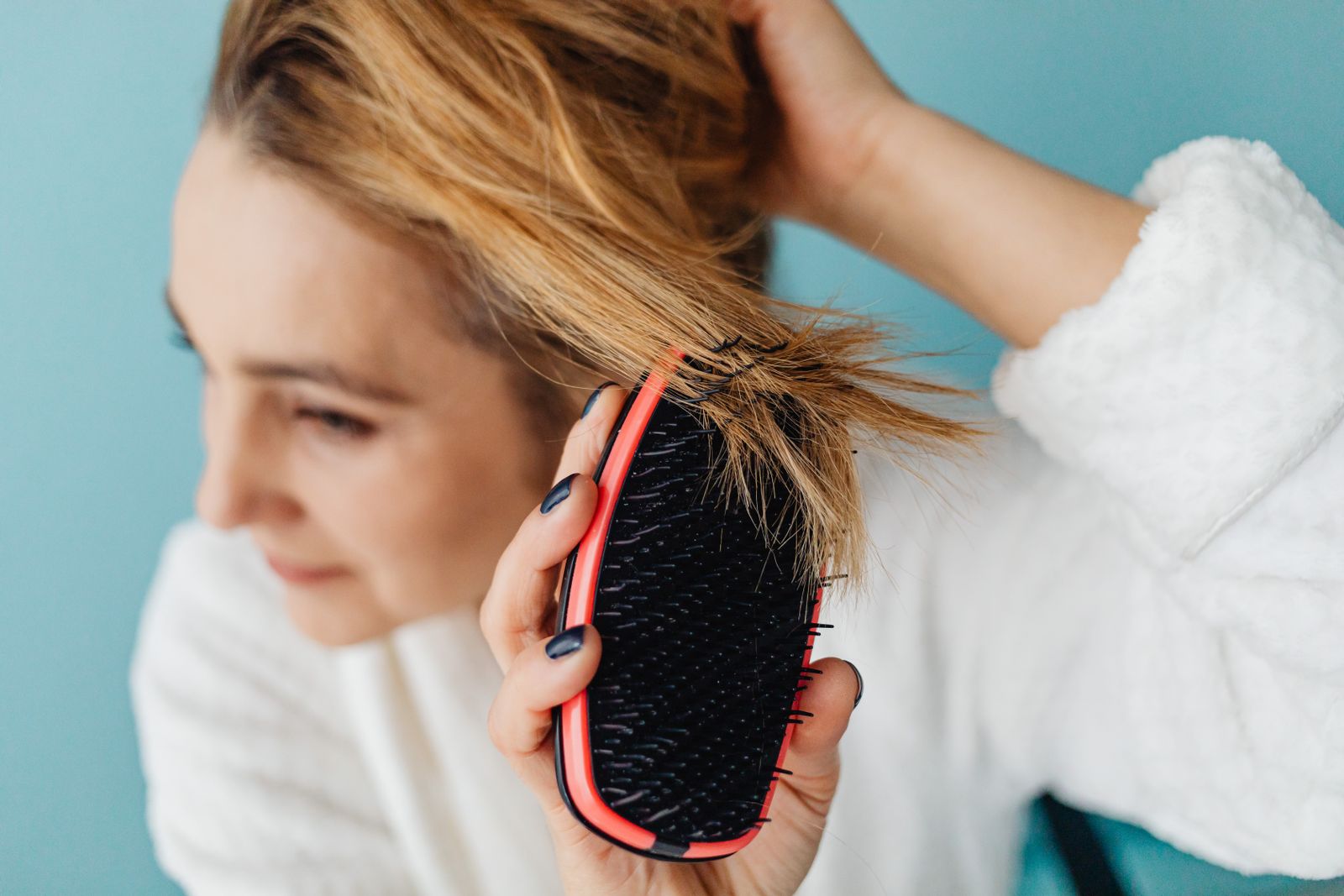 Woman with healthy long hair after a yoga and hair care routine