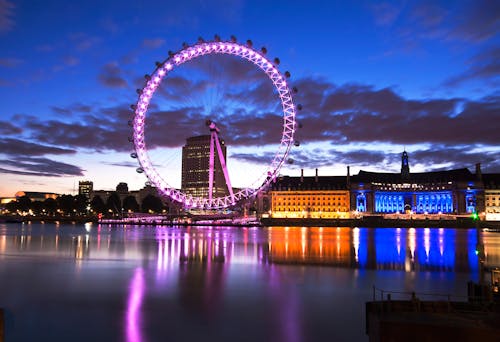 Ferris Wheel Near River during Dawn