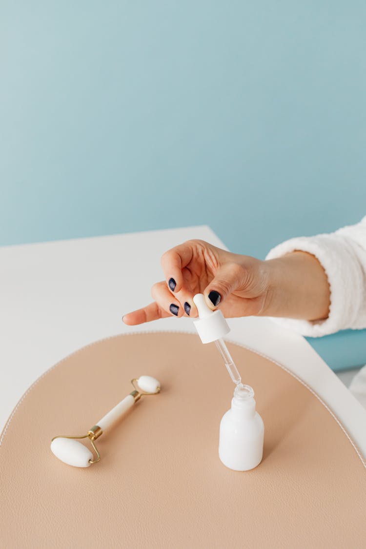 Woman Holding A Skincare Product