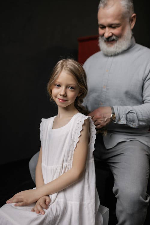 Free Grandfather and Granddaughter Smiling Stock Photo