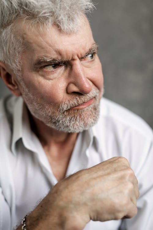 Free Close-Up Photo of an Elderly Man Looking Grumpy Stock Photo