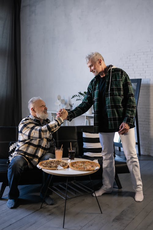 Free Elderly Men Greeting Each Other Stock Photo