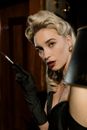 Photo of Beautiful Woman Holding Cigarette Holder