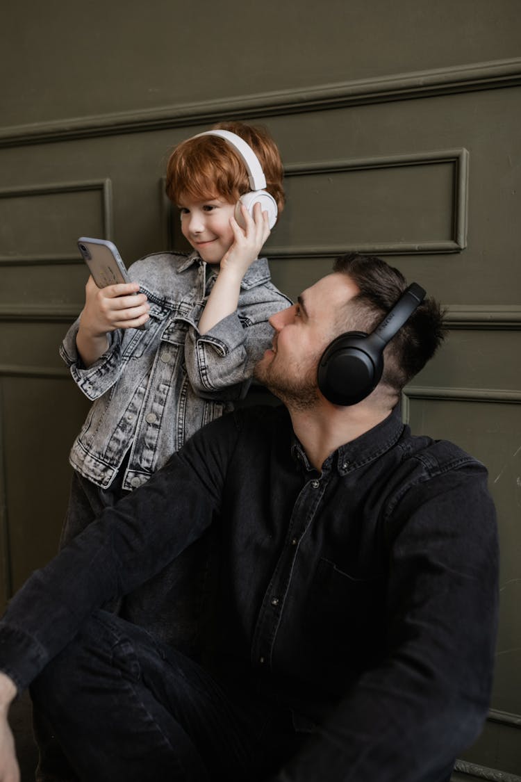 Father And Son Listening To Music