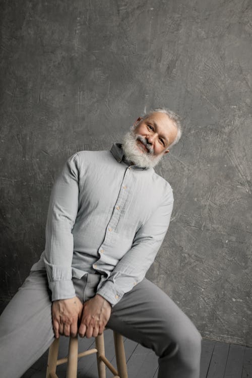 Free Elderly Man in Gray Long Sleeves Smiling Stock Photo
