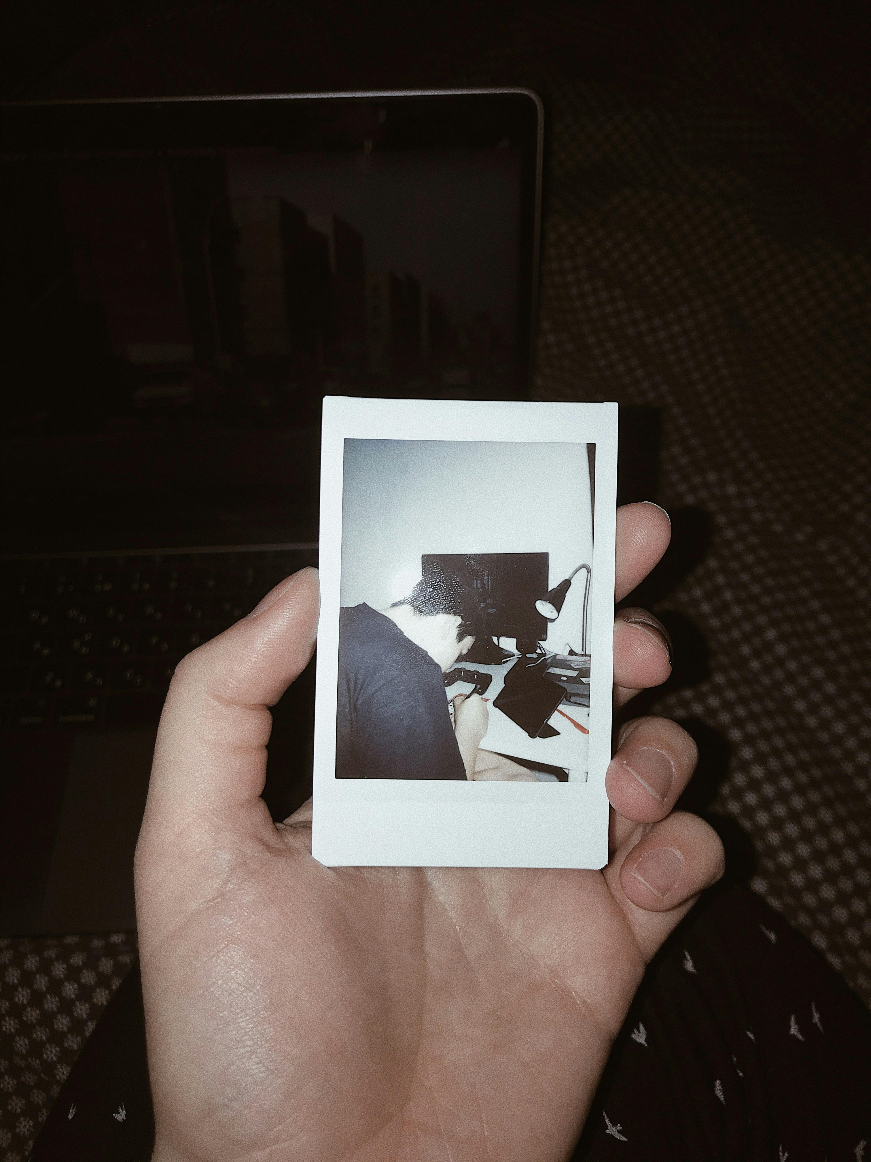 Person Holding Polaroid · Free Stock Photo