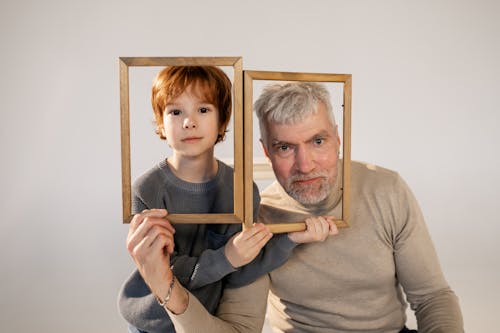 Grandfather and Grandson Having Fun with Frames