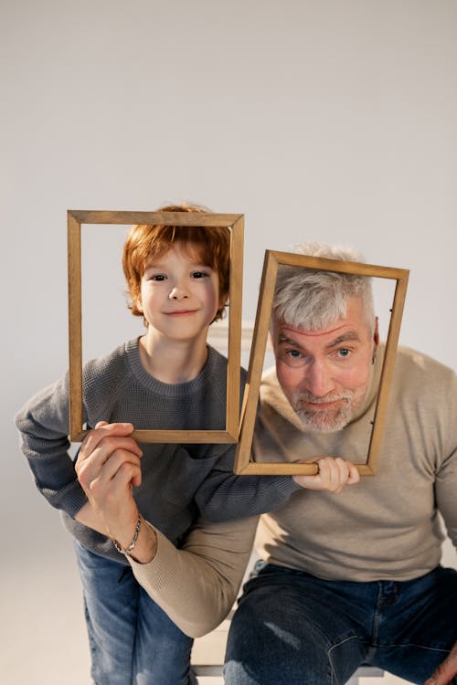 Grandfather and Grandson Having Fun with Frames