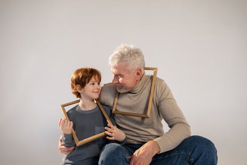 Grandfather and Grandson Having Fun with Frames