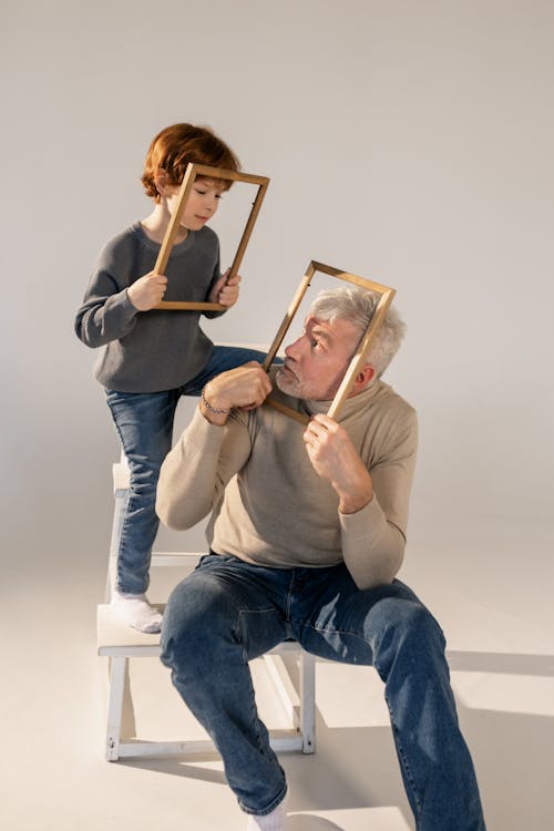 Grandfather and Grandson Having Fun with Frames