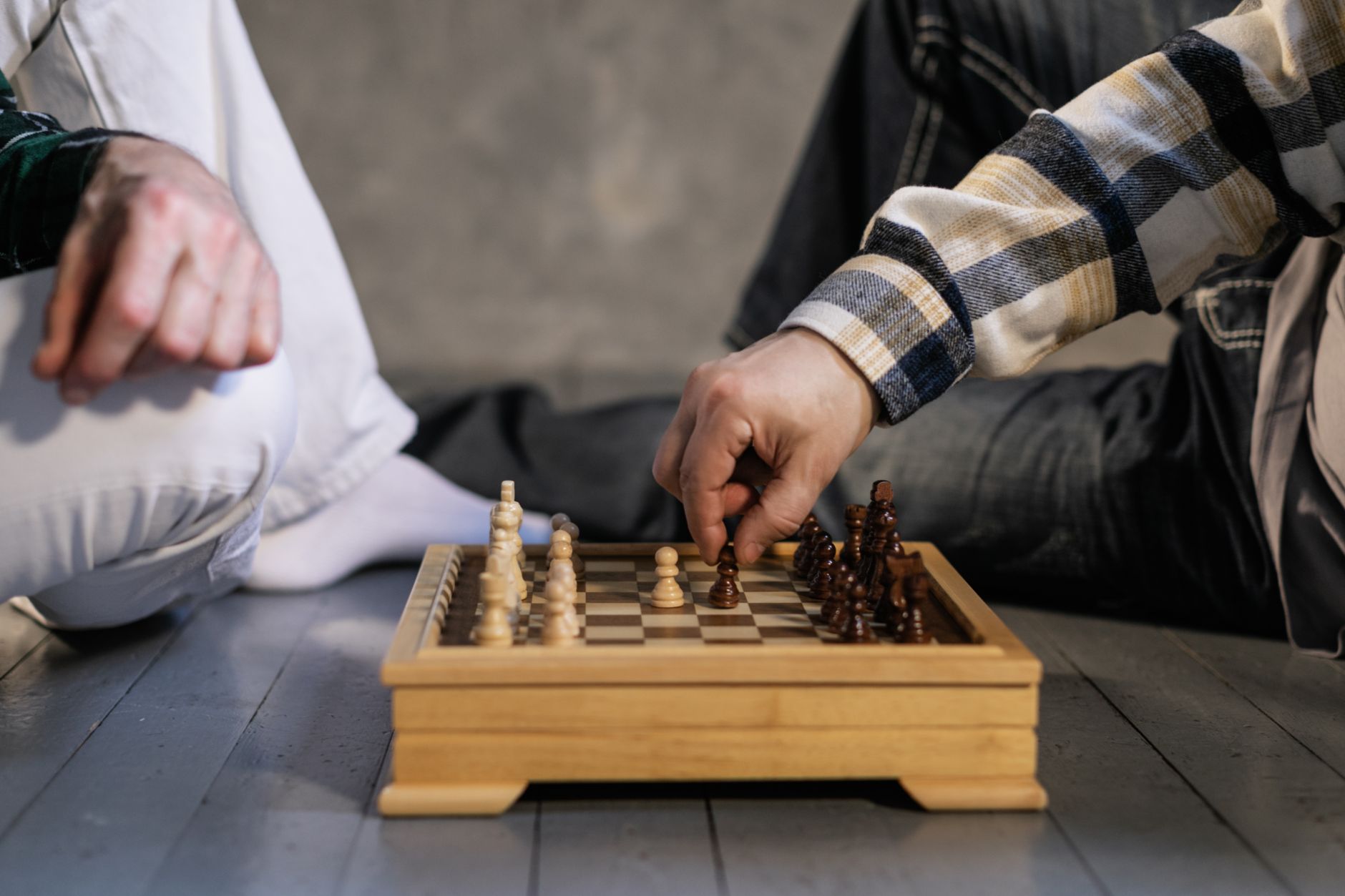 An intense chess game in progress showing strategic moves and focused concentration.