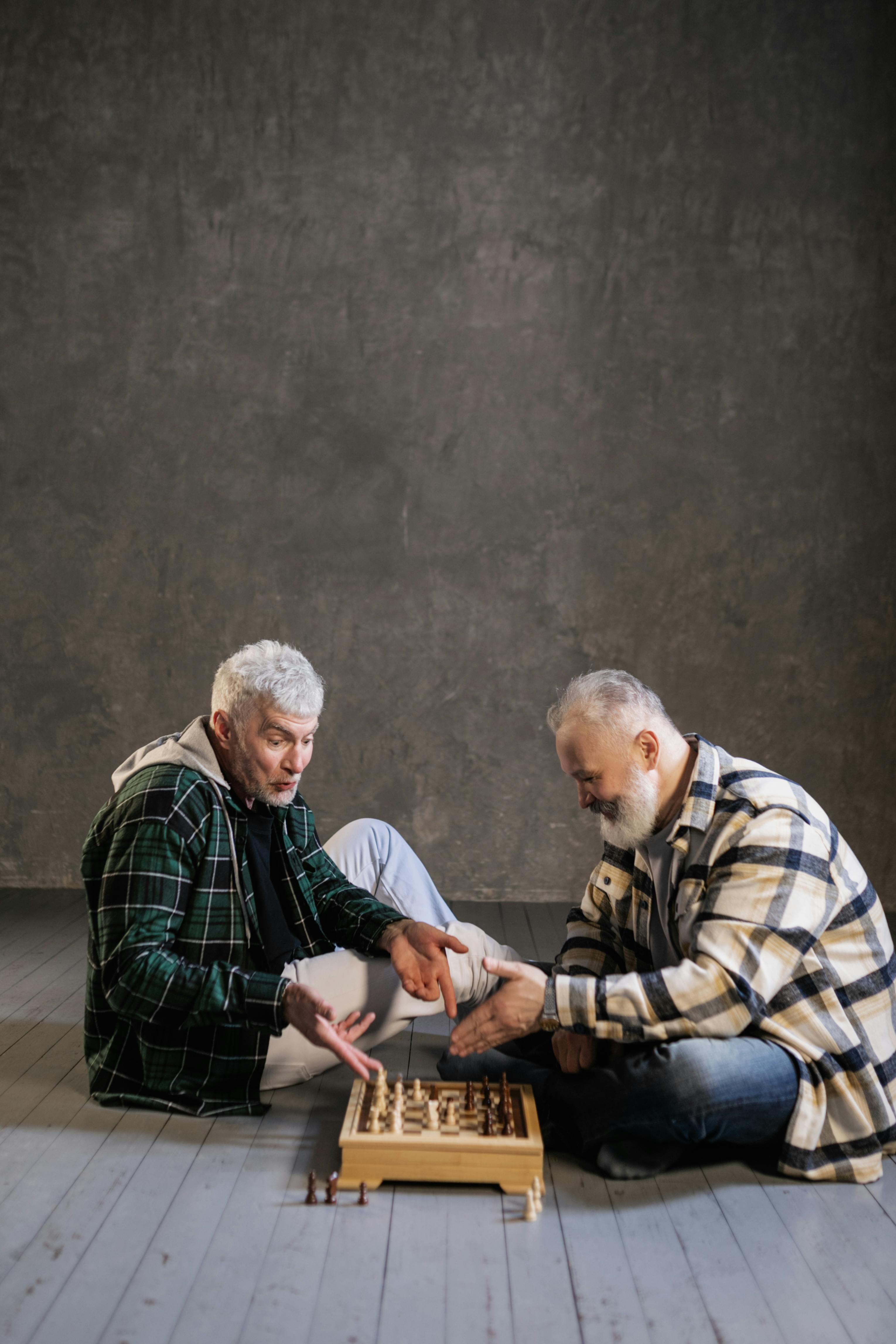 elderly men playing chess