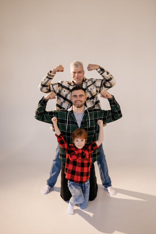 Free A Family Showing Off Their Muscles Stock Photo