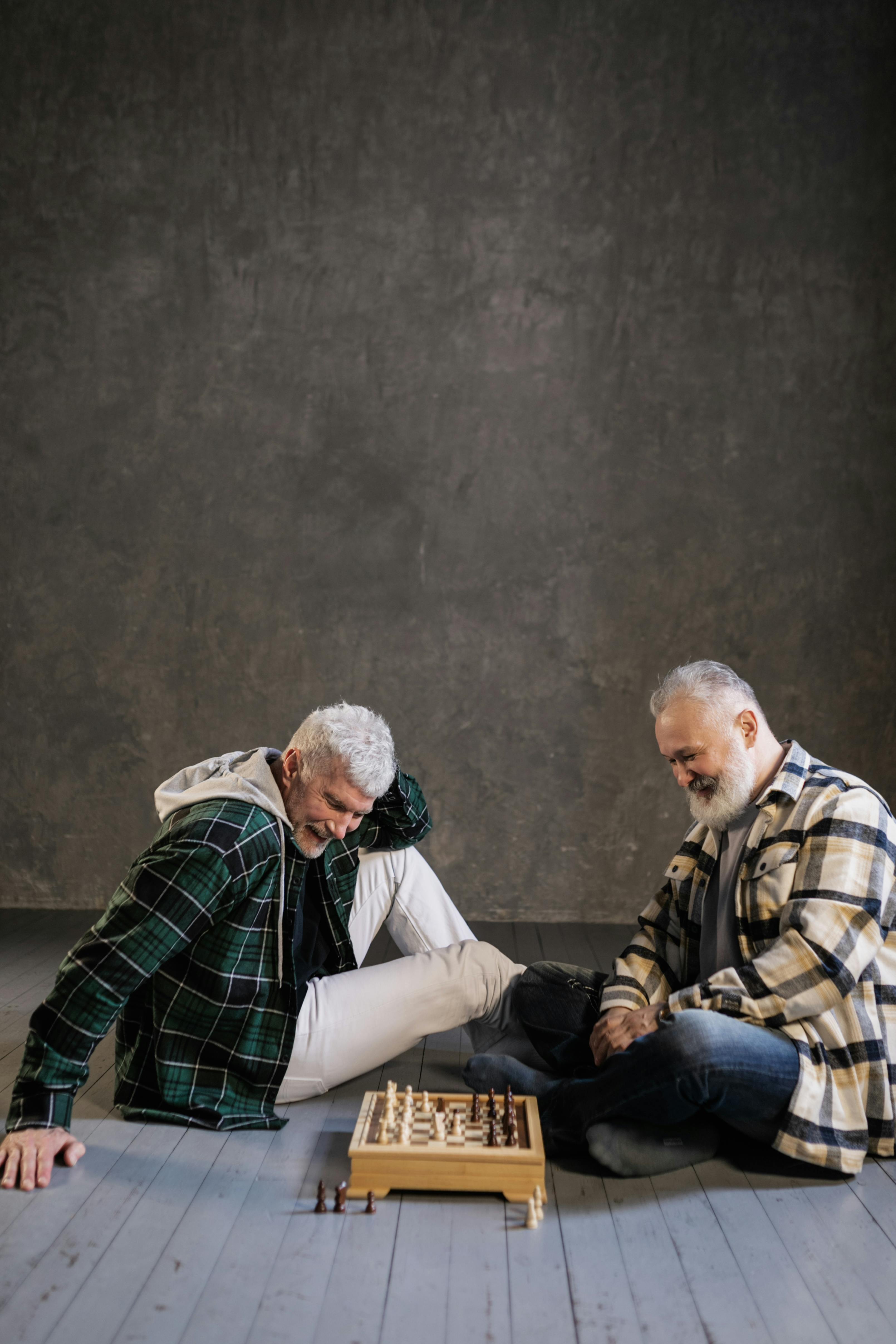 elderly men playing chess