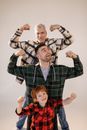 A Family Showing Off Their Muscles