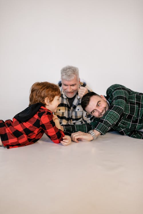 A Family Having Fun Playing Arm Wrestling