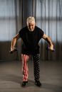 An Elderly Man Lifting Dumbbells