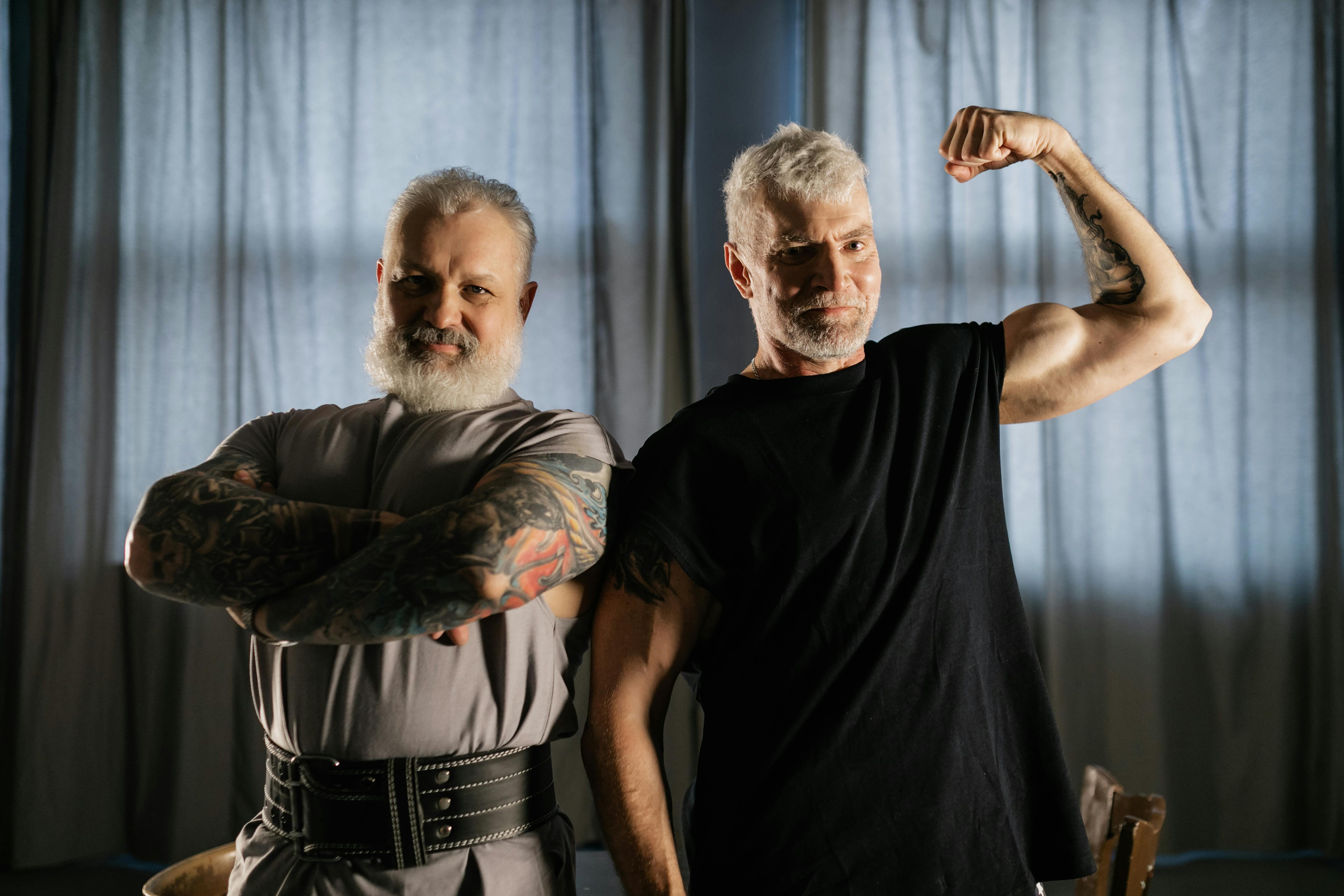 elderly men showing off their muscles