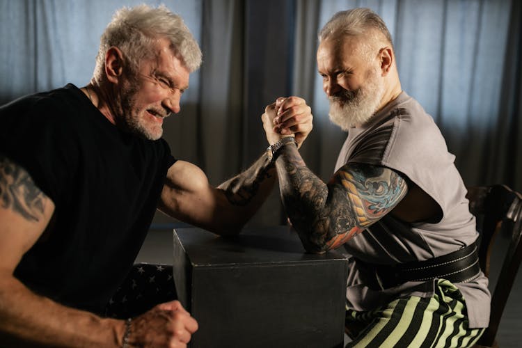 Elderly Men Doing An Arm Wrestling Match