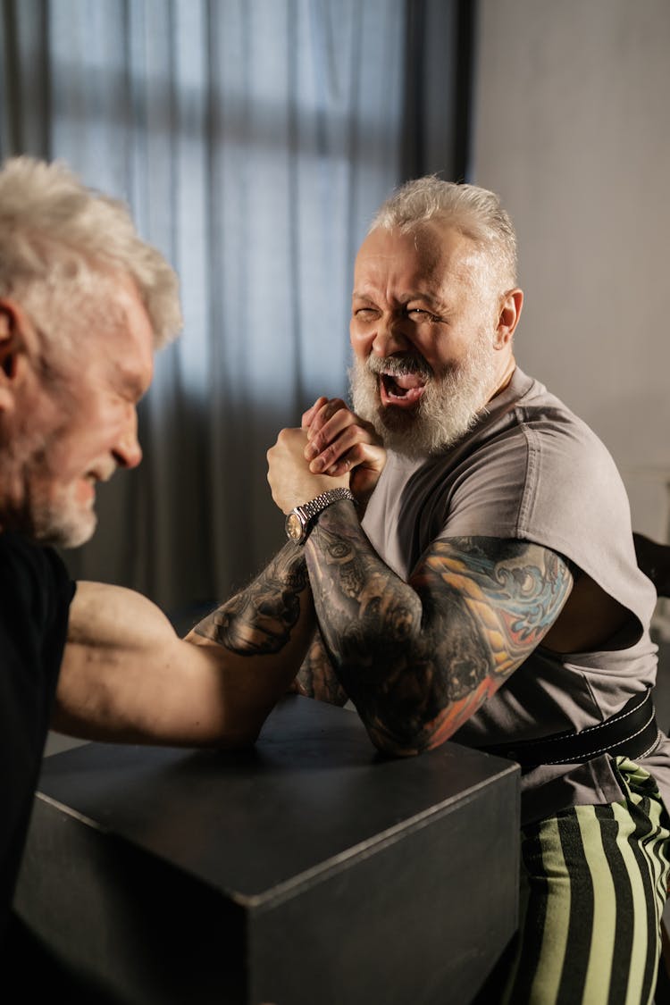 Elderly Men Doing An Arm Wrestling Match