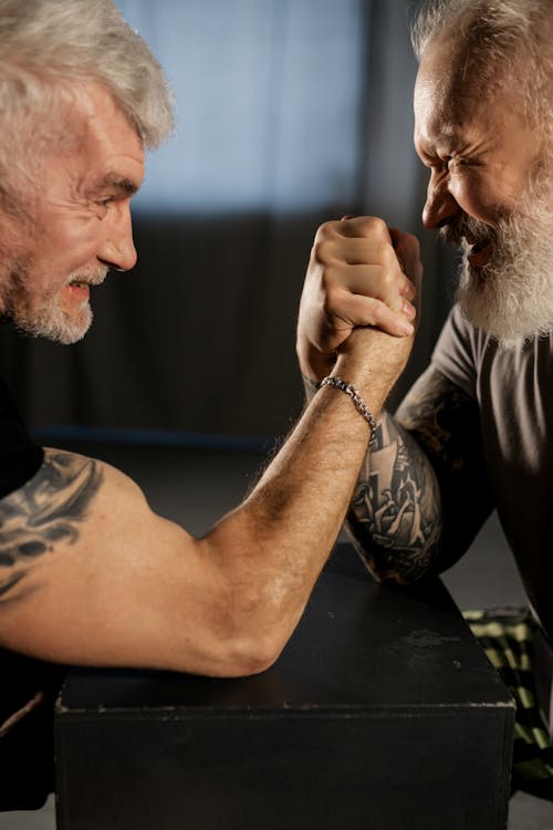 Elderly Men Doing an Arm Wrestling Match