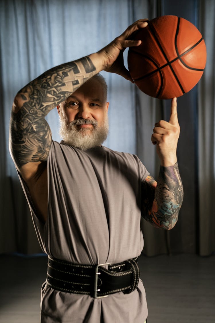 Elderly Man Holding A Basketball